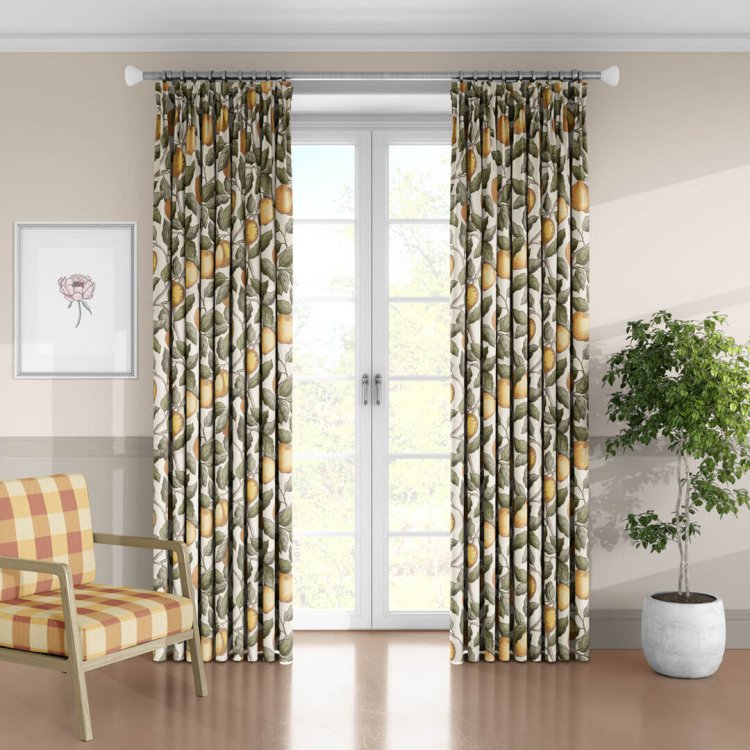 Botanical apple print curtains in a bright living room with plaid armchair and potted plant